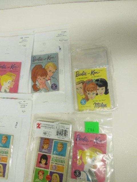 Lot of Barbie Accessories: Including: (2) Modern miniatures, piano and stereo, in original packages 1981 telephone book, Barbie flash cards and (12) Barbie and Ken Fashion booklets. CONDITION: Minor wear from age and use.