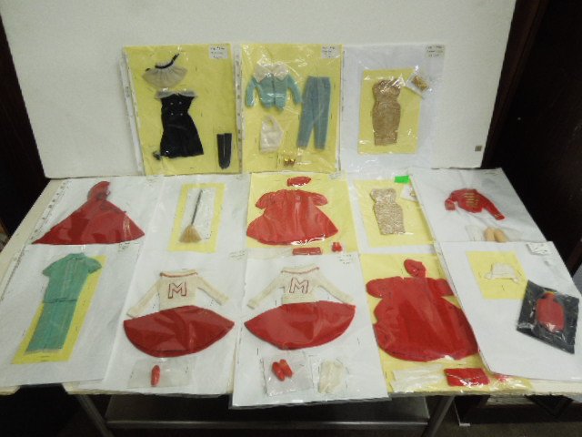 (13) 1960s Barbie Outfits: Including: (2) #911, 934, (2) 939, 802 (Broom), (2) 876, 880, 1601, 876 and 889 (not water bottle and cap). CONDITION: Some wear from age and use, some outfits may not be complete.