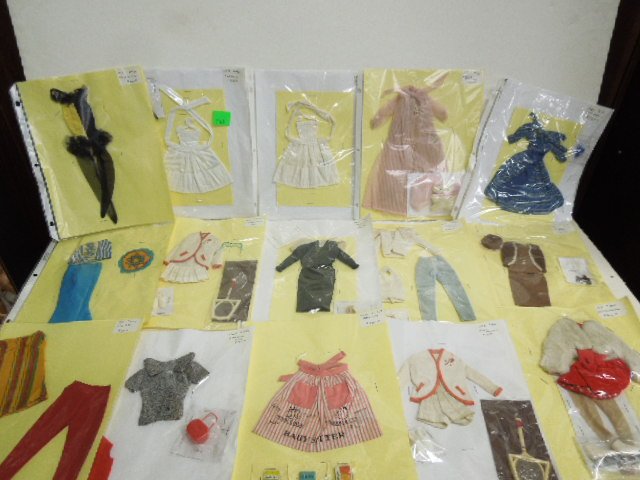 (14) 1960s Barbie Outfits: Including: (2) 962-white, 965, 978, 937, 942, 960, Mood for Music, (2) 961, 953, 956, 964, (2) 7726. CONDITION: Some wear from age and use, some outfits may have staples through them, some outfits may