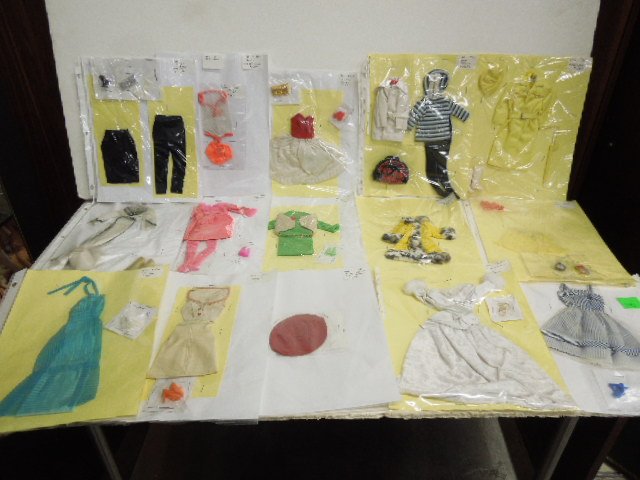 (14) 1960s Barbie Outfits: Including: #933, 973, 975, 977, 1160, 1459, 1492, 15901, 1663 (hat), 1683, 1759, 7809, 9970, plus (1) 1963 Satin and Black. CONDITION: Some wear from age and use, some outfits may not be complete.