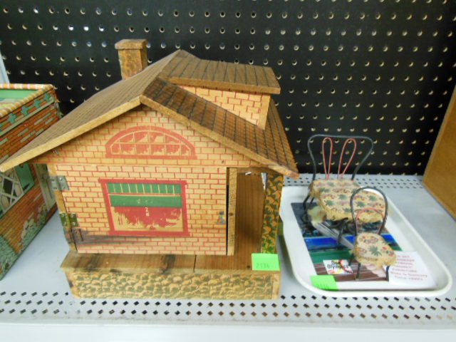 1915 Converse Co. wood dollhouse with furniture: 1915 Morton E. Converse Co. wood dollhouse, (1) room with front porch, side wall opens to access rooms, Interior of house is unfinished, Exterior design is stenciled over wood, 1 step in front of hous