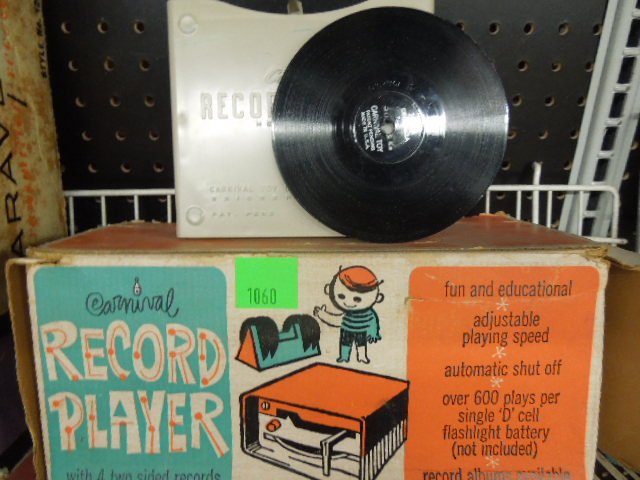 Carnival Childrens Portable Record Player: Carnival Childrens portable record players in original box, with 4 records. CONDITION: Good. Untested.