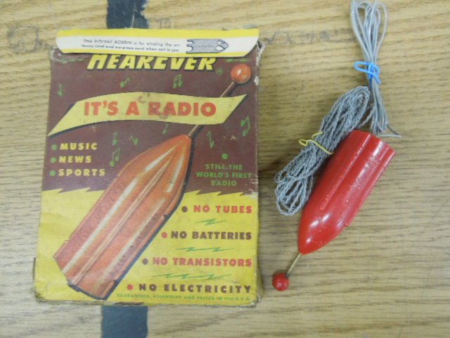 Vintage Hear Ever Rocket Form Radio: Vintage Hear Ever Rocket form radio with original box. CONDITION: Fair, shows some wear, box has wear.