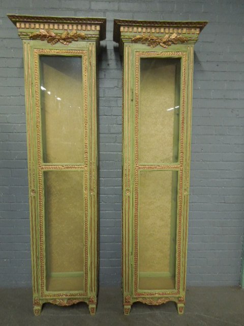 Pr Venetian style Vitrines: Pr Venetian style vitrines; celery green painted wood case with link, rosette & foliate gilt borders & carvings, glass doors, side panels & shelves, early to mid 20th C; 22" x 79" x 13" Condition: goo