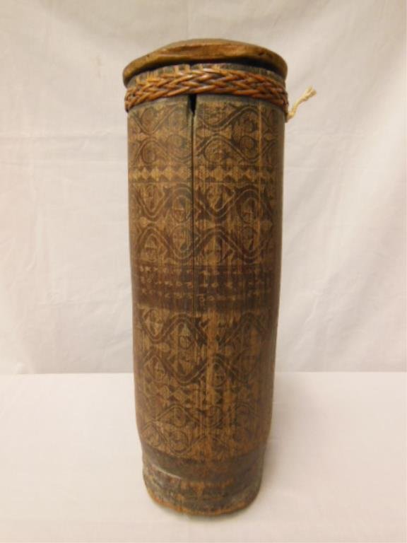 Indonesian Traveling Medicine Case: Indonesian etched wood and wicker tubular traveling medicine case, together with Indonesian doctor's "horoscope" sheet, early - to - mid - 20th C. 15" = l. CONDITION: No issues identified.