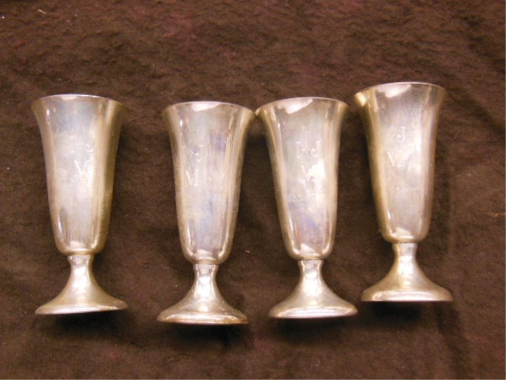 4 Sterling Wine Goblets: Boxes set of four sterling silver trumpet form wine goblets with circular foot, monogrammed "I + J M", 2 7/8" h, in original "Gorham Sterling" marked green and gold velour fitted box; 2.6 ozts TW. CON