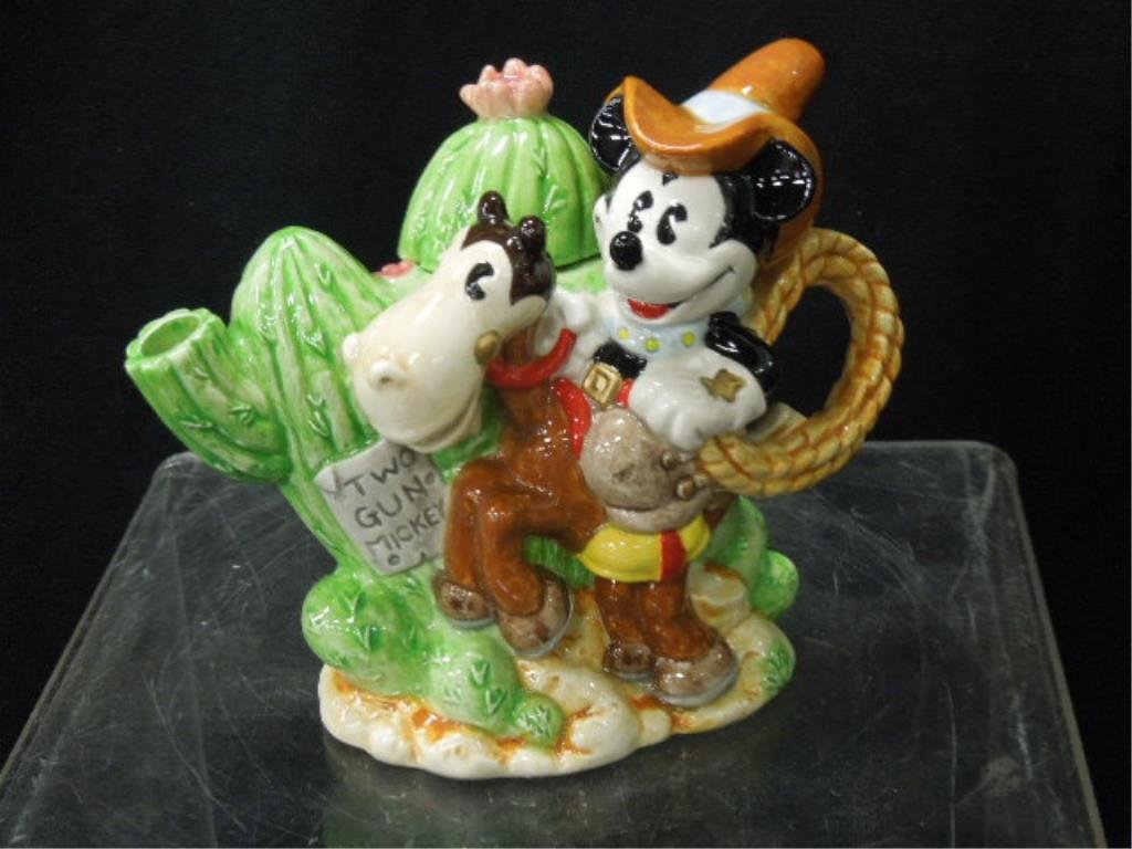 Two Enesco MM Mini Teapot NIB: Two Enesco two-gun Mickey porcelain mini teapots, new in boxes, #312835, 5" h. CONDITION: NIB, no issues identified.