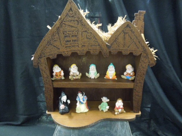 Set of Snow White Thimbles w/Display + others: Set of (9) Snow White and The Seven Dwarf's resin figural thimbles featuring: Snow White, 2 5/8", Seven Dwarfs, 1 7/8" each and The Evil Witch, 3" in a wood house form open shelf (two shelves) with th