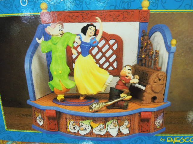 Enesco Snow White & The 7 Dwarfs Musical: Enesco Small World of Music, Disney's Snow White and The Seven Dwarfs, multi-action musical box, plays tune - "Whistle While You Work", on / off switch on back, 5 1/2" x 7 1/2" x 6"h, with original bo