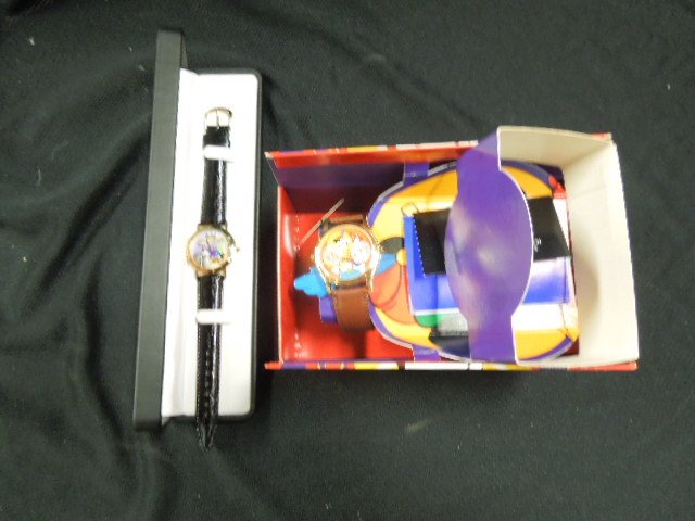2 Disney Wrist Watches: Including: One Fantasma, 1993, with Mickey & Disney characters face, small hour, minute and second hand dial on right side, limited edition of 1800, brown leather band and one 1996 Disney Time Works N