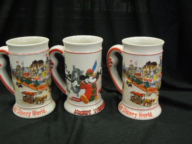 3 Disney Steins: Three Disney steins featuring: two Walt Disney World and one Mickey through the Years, 6 1/2" each all with handles. CONDITION: No issues identified.