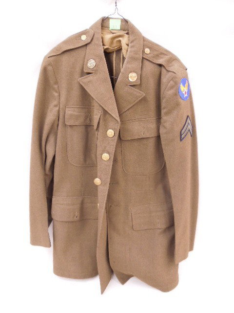 US Military Dress Jacket: U. S. Military dress jacket with patches and pins, size 40L. CONDITION: Good, some very minor moth damage.