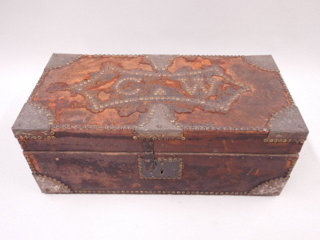 Trunk Owned by Cadmus Marcelus Wilcox: Trunk owned by Cadmus Marcelus Wilcox (1824-1890) wood with brass studs, reads C.W. over leather remains. Measures 11 1/4" x 9 3/4" deep. Manufactured by Robert Roberts NY. CONDITION: Considerable age
