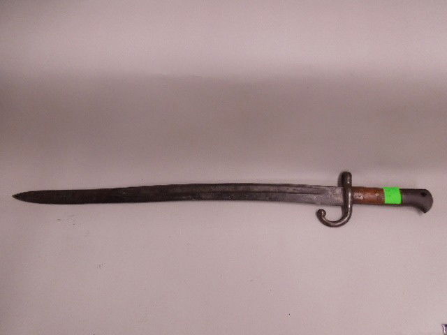 French Bayonet 19th / 20th C.: French Bayonet 19th / 20th C., wood and metal handle (marked with C K and H0, curved guard with finial end, 22 1/2" blade ( S mark at base), 281/2" overall length. CONDITION: Missing press stud and si