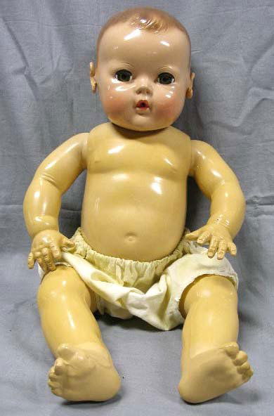 "Eff-An-Bee" Baby Doll: Eff-An-Bee Baby Doll with rubber body & ears, hard plastic head. 20" height. This doll drinks a bottle (not included) & drip opening in rear.