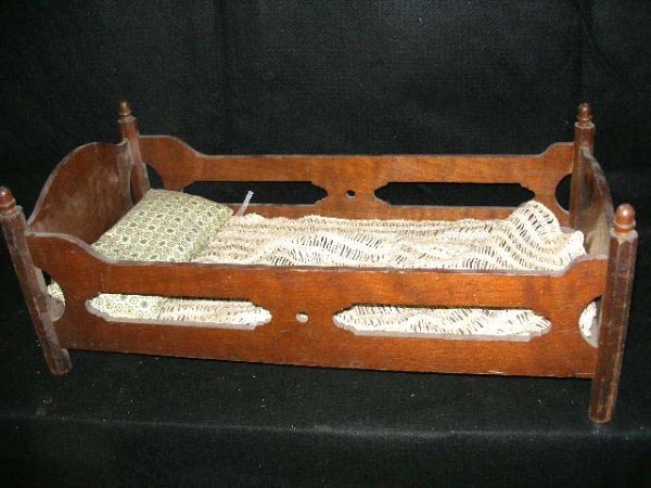 Hand made walnut doll bed