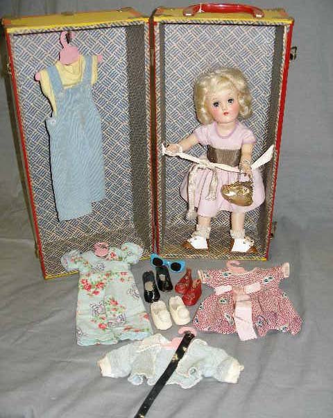 Vintage plastic doll with travel case made by Ide