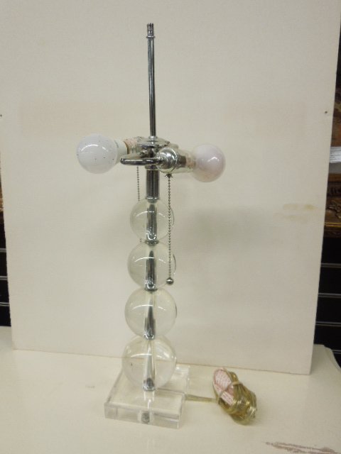 Modern Era Glass & Lucite Lamp: Modern era graduated crystal glass balls on lucite base 24 3/4" (h) table lamp. CONDITION: Very good working condition.
