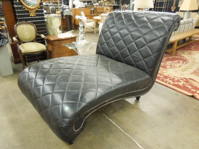 Chesterfield Style Chaise Lounge for Two: Chesterfield style chaise lounge for two, black leather diamond stitch pattern, scrolled back sides with brass tacking, ebonized turned legs, mid to late 20th C., approximately 47" x 68'. CONDITION: M