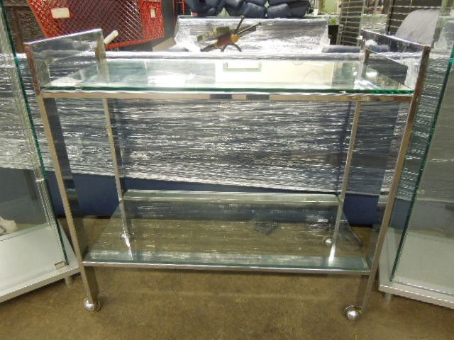 Modern Era Serving Cart: Modern era serving cart, chromed flat rod construction with plate glass tops and base shelf, casters, c 1970-80, 33" x 16" x 32 1/2". CONDITION: Modest wear, very good.