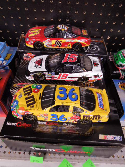 3 Diecast Scale Stock Cars: Three diecast 1:24 scale stock cars. Includes: Racing Champions Bill Elliot with COA, RCCA Elite Tony Stewart, no COA, Team Caliber Ken Schrader with COA. CONDITION: Very good.