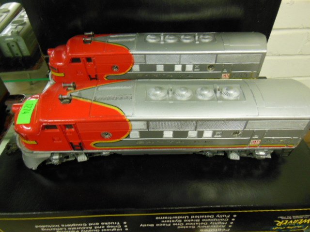 Lionel 2343 Engine w/Unpowered Unit: Lionel Santa Fe 2343 engine with unpowered unit, used, untested, 13 1/2" heach both with GM Decals on each side. CONDITION: Wear from use, some paint loss and surface scratching.