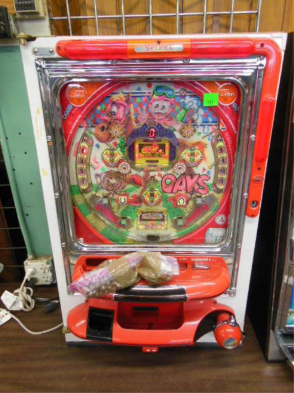 Beleza Pachinko Machine: Beleza Pachinko machine, new game "Sansei" with metal balls, no back, lights up when plugged in, balls go through machine when bottom crank is turned, no key, 20 1/2" x 31 1/2". CONDITION: Some wear.