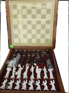 Franklin Mint Chess Set: Franklin Mint chess set, Battle of the Gods featuring Roman (in black) eagle pawns Gods vs Greek (in white) Gods, griffin pawns, large porcelain figures, 3" to 6" gold accent on figures, with extra wh