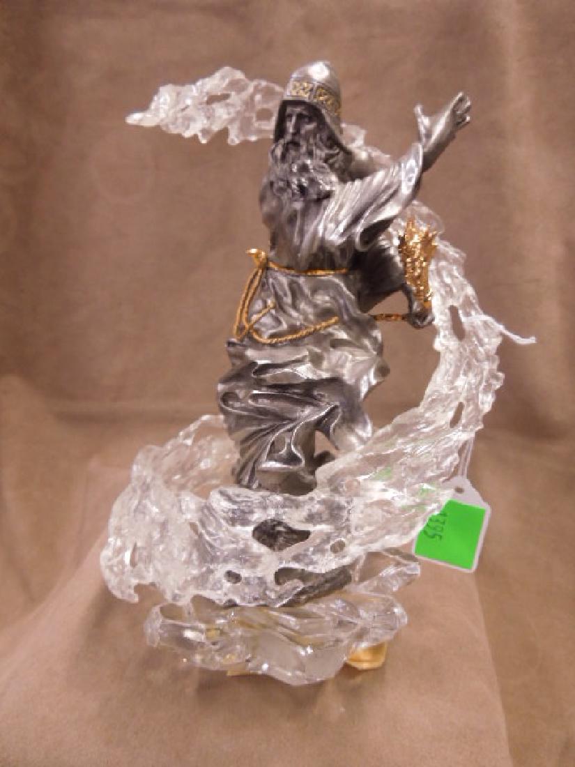 Franklin Mint Pewter Wizard Sculpture: Franklin Mint Pewter Wizard Sculpture with gold accent rope belt, helmet and dragon staff on crystal rock form base, plastic swirl around Wizard detached, 9 1/2". CONDITION: Some pewter may be bent.