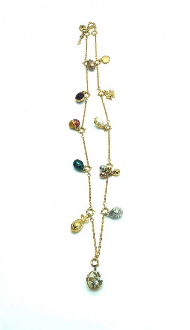 Joan Rivers charm necklace with 12 charms: Joan Rivers Egg Charms gold tone necklace with 12 charms incl Faberge Eggs, Locket, Lock & keys