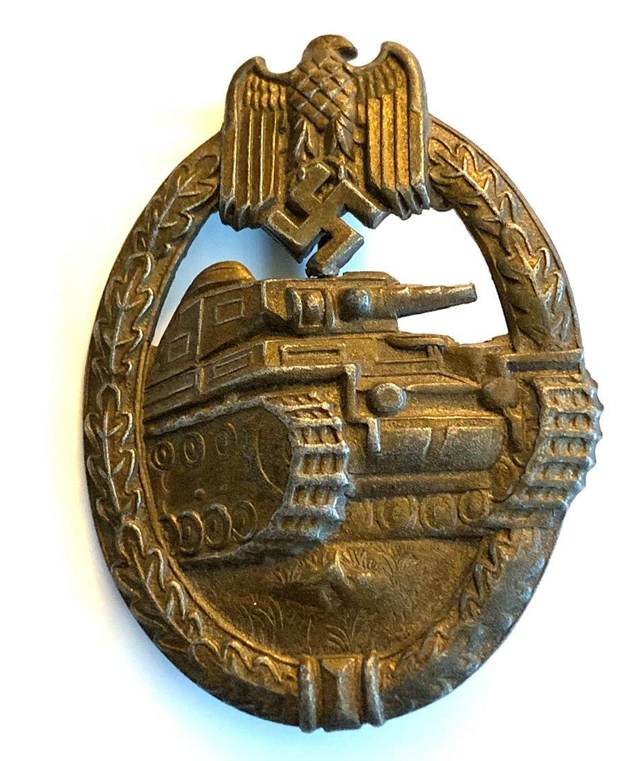 WWII GERMAN BRONZE TANK PANZER ASSAULT BADGE: WWII German Tank Panzer Assault Badge. Think vertical pin back with a "C" catch. Stamped construction, unmarked. Awarded for three combat encounters. In overall good condition with some patina and sma