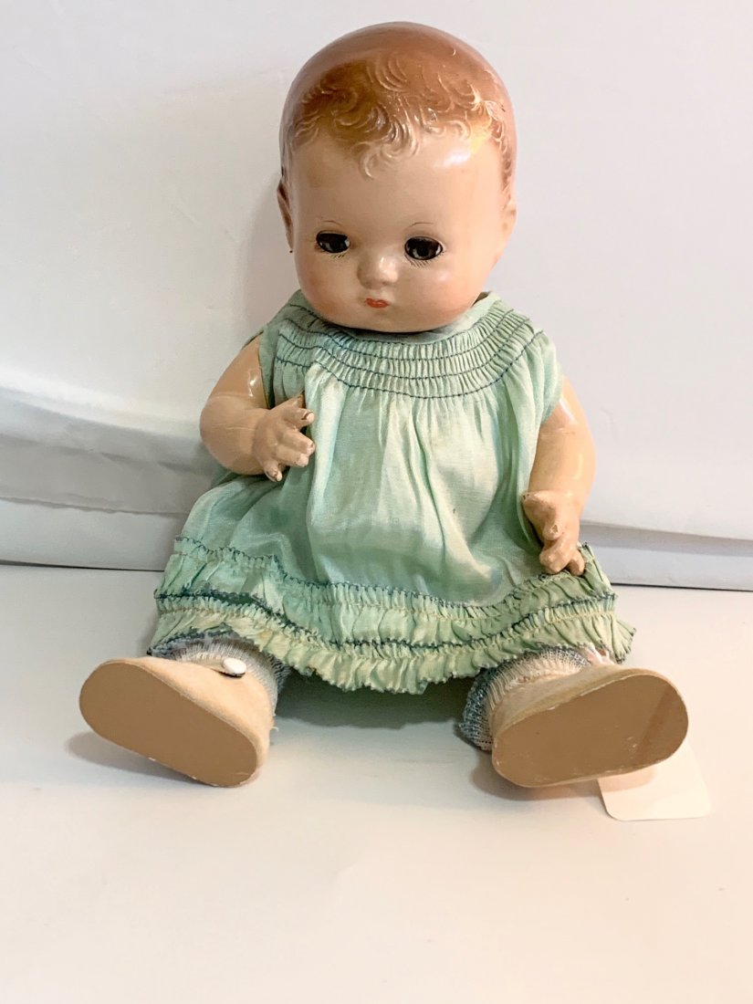 B1: Effanbee "Patsy Baby": Effanbee Patsy Baby-12" Composition Doll in good condition. Effanbee Blue/Green Dress, snap missing and fabric tears in the undergarment, holes in socks