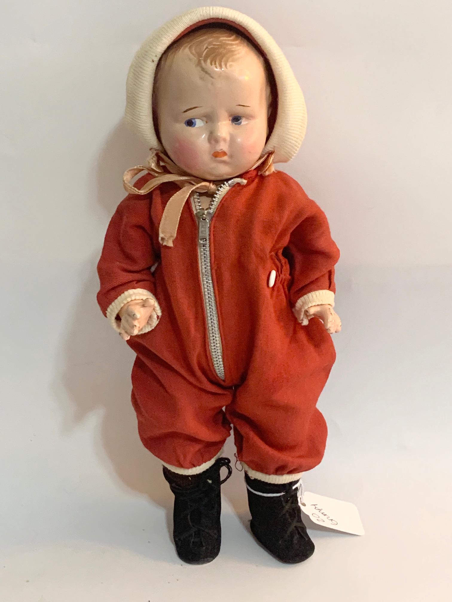 B2: Effanbee Grumpy Baby Boy: Effanbee Grumpy Baby Boy 12" Shoulder head; cloth body in good condition; red snow suit and hat replaced.We do our best to list all possible flaws, these are vintage/antique dolls and are NOT perfect.