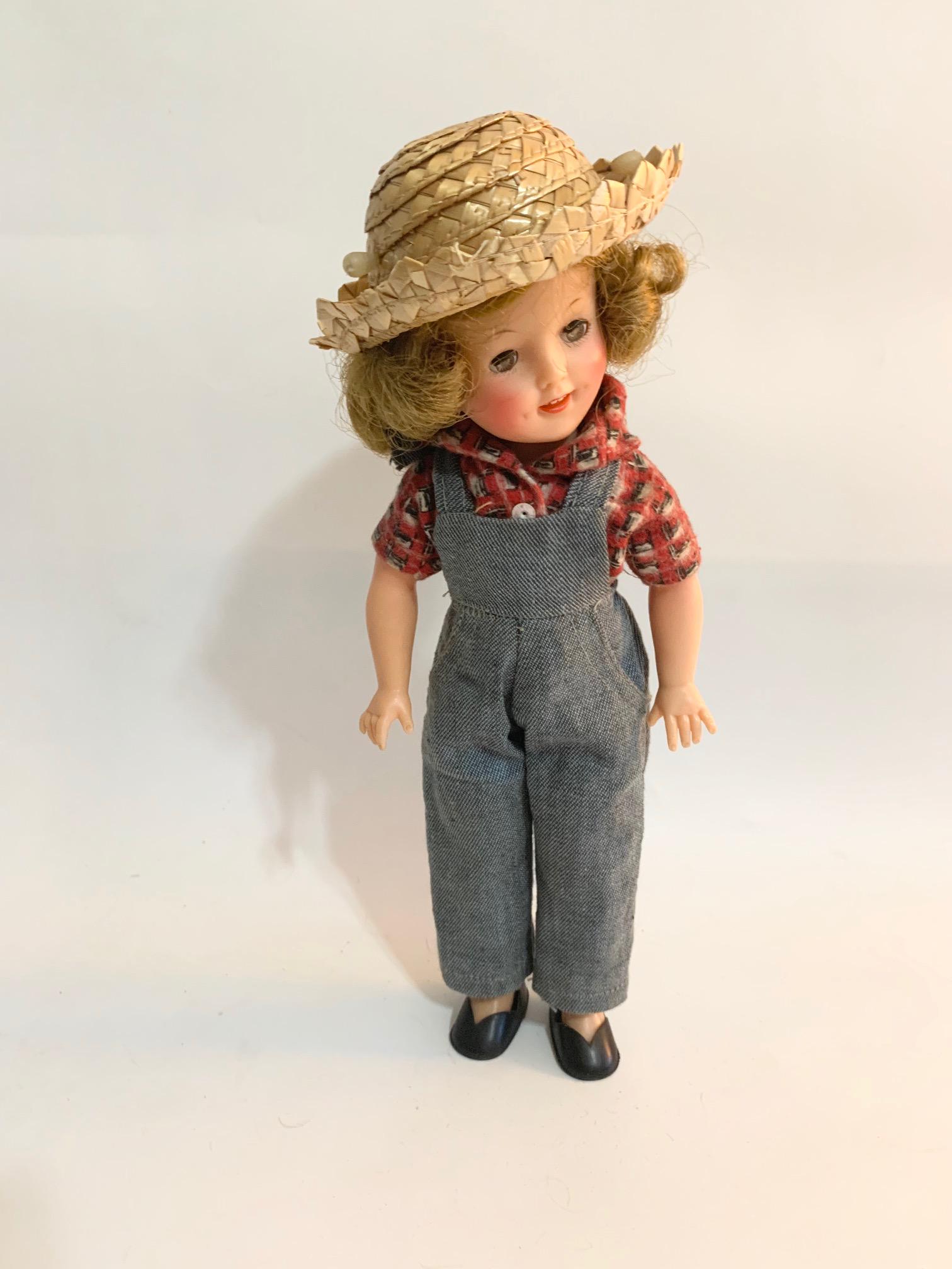 B2: Rebecca of Sunnybrook Farm Shirley Temple: Rebecca of Sunnybrook Farm 11" Vinyl Shirley Temple Doll in good condition; original clothes and wig. We do our best to list all possible flaws, these are vintage/antique dolls and are NOT perfect. Pl