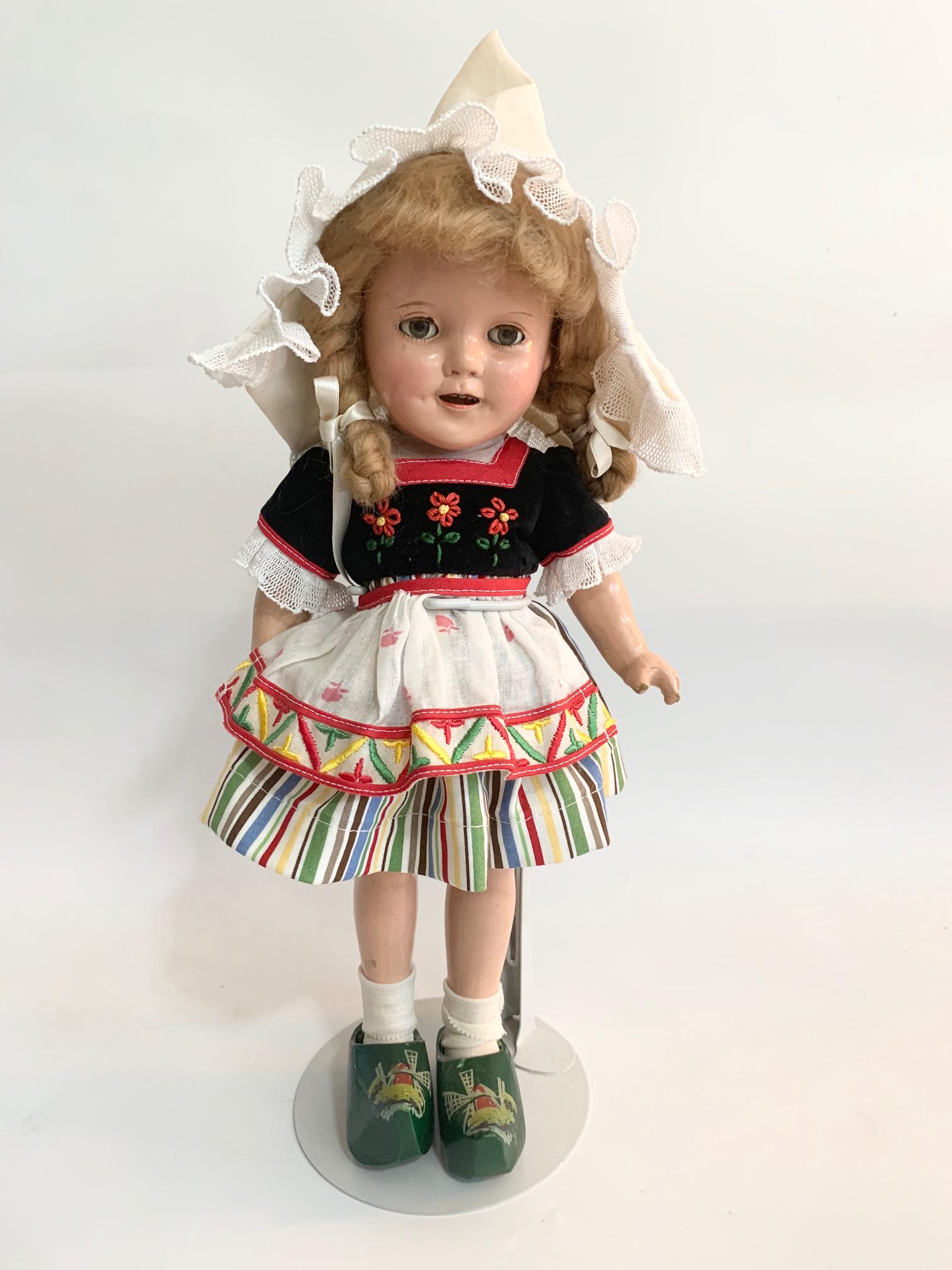 B3: 13" Shirley Temple Heidi Doll: Shirley Temple Doll 13" Composition Doll in good condition. Original wig; Head is marked Shirley Temple as well as back. We do our best to list all possible flaws, these are vintage/antique dolls and 