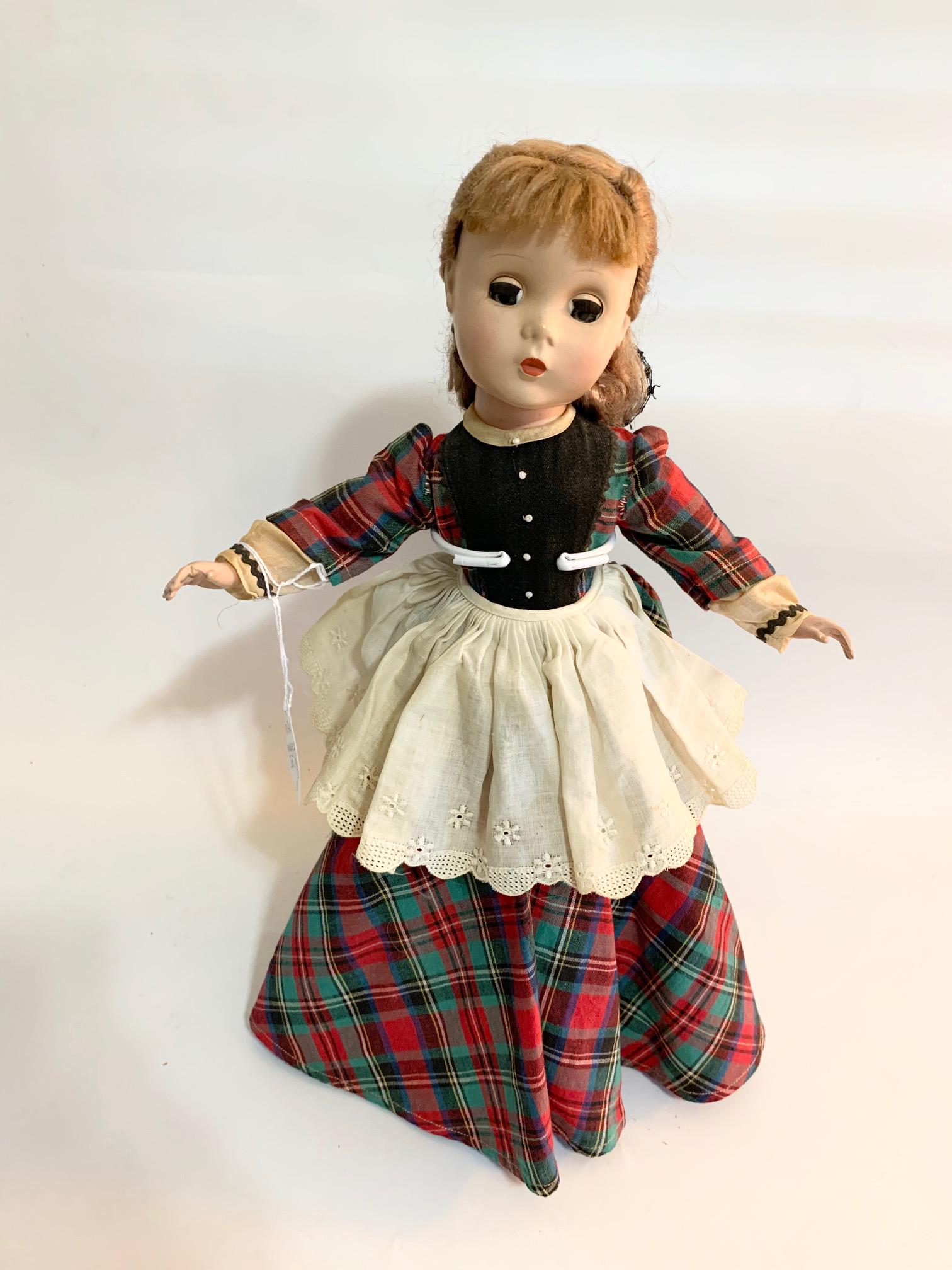 B4: Madame Alexander Jo Little Womens Series: Madame Alexander Jo Little Womens Series; Maggie Face; 14" Hard plastic doll in good condition; Original cotton plaid dress; original shoes; original wig.