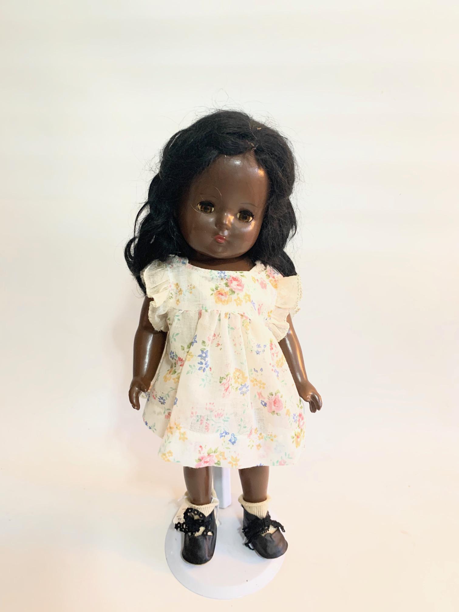 B4: 1935 Effanbee Patricia Black Girl Doll: 1935 Effanbee Patricia Black Girl 16"; sleep eyes in very good condition; minor pait rub; old floral print little girl dress probably not original to doll, replaced shoes and socks; original wig.
