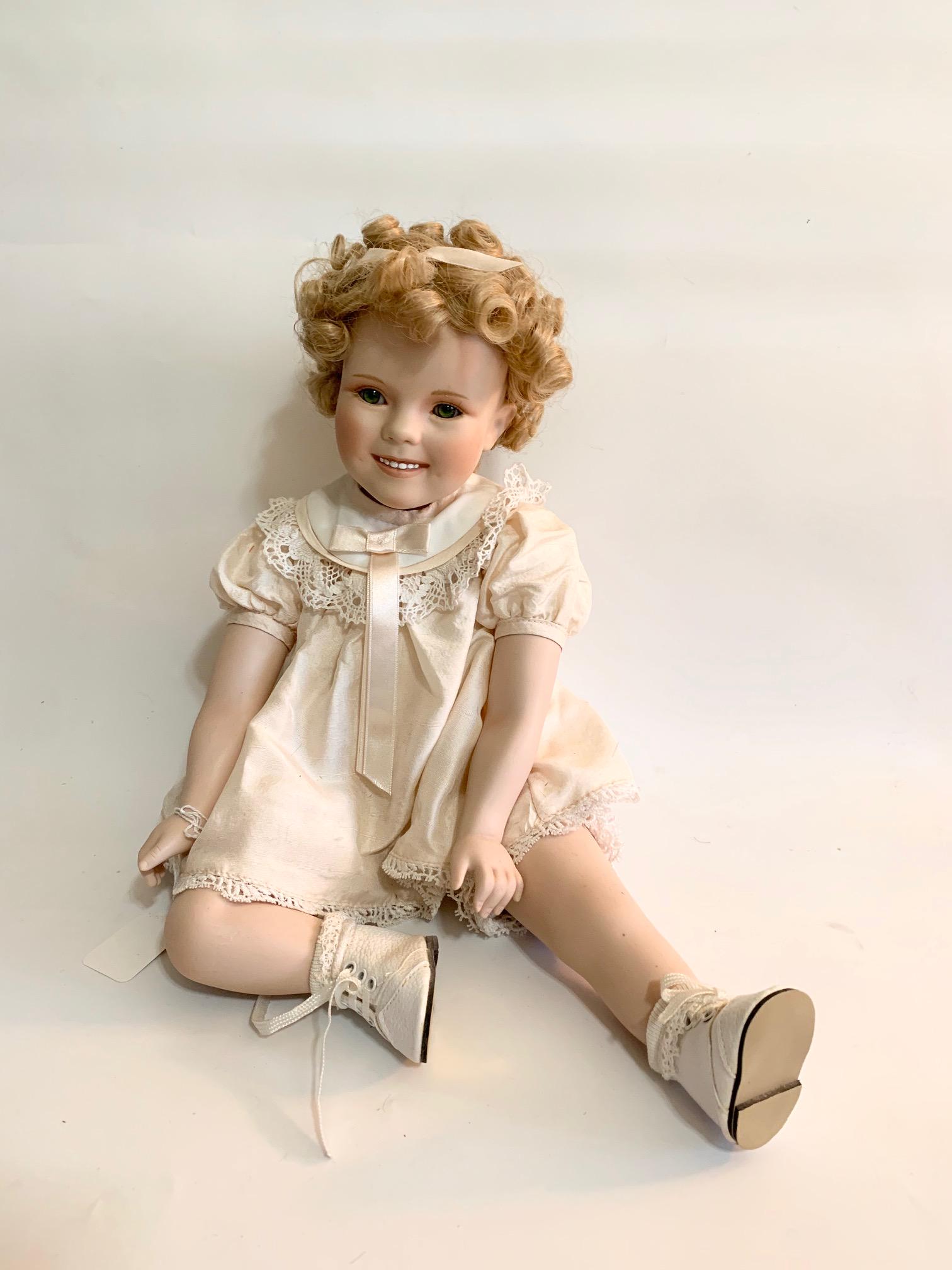 B4: Shirley Temple 1996 Seated: Seated Shirlley in Pink Dress 1996 Artist Doll; molded plastic/vinyl material; issued by Danbury Mint in very good condition; all original