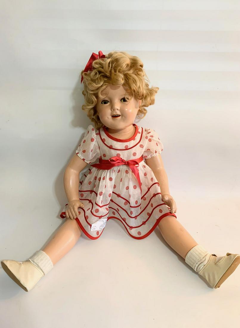 B6:Shirley Temple Stand up & Cheer 27" Composition Doll: Shirley Temple Stand up and Cheer; 27" composition; new reproduced copy of red coin dress; original underwear; replaced wig. We do our best to list all possible flaws, these are vintage/antique dolls 