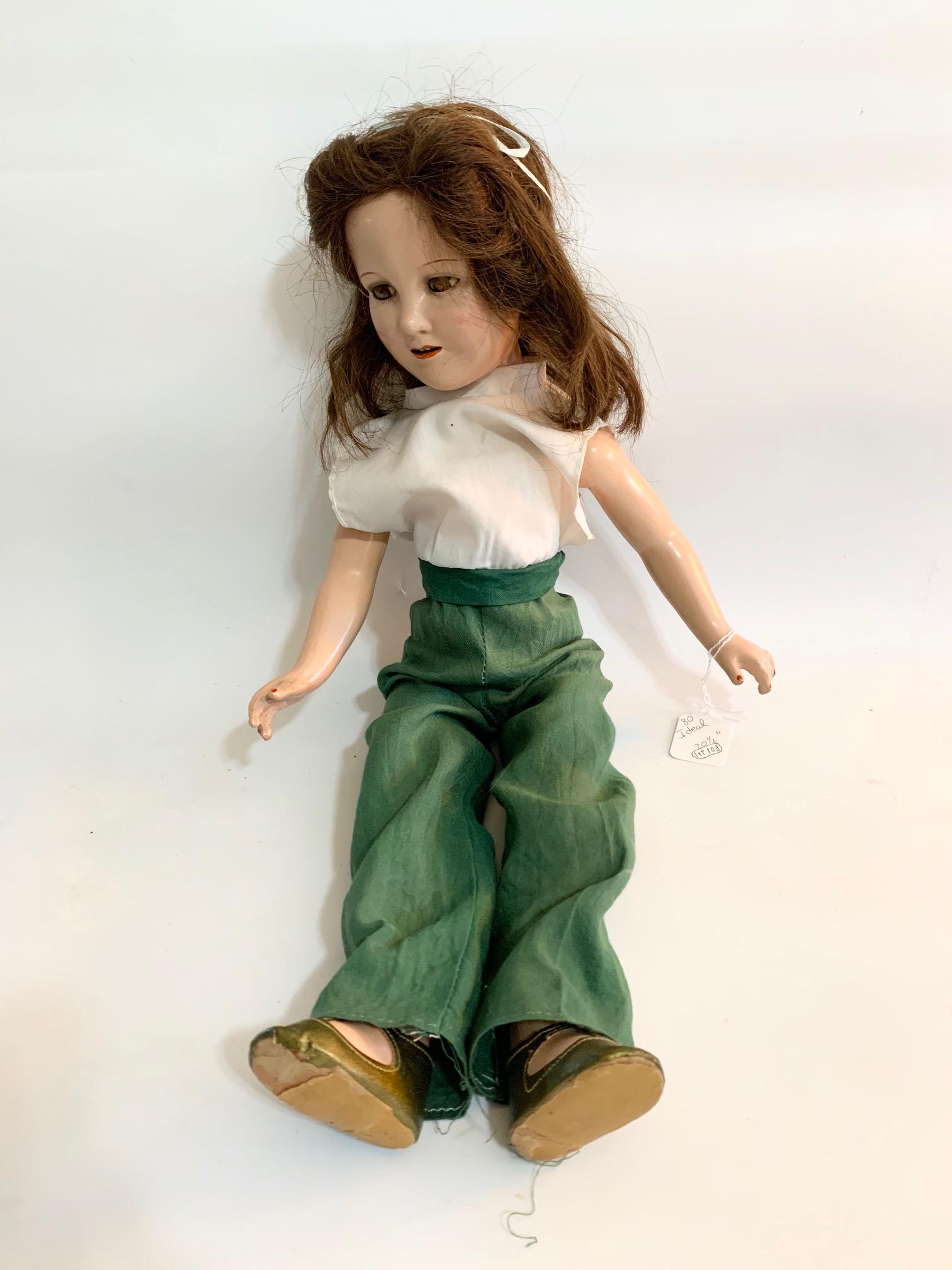 B7: Deanna Durbin Ideal 20" Composition Doll: Deanna Durbin Ideal 20" Composition; green linen pants with sewn in blouse may be original; old dark brown wig, may not be original to doll. We do our best to list all possible flaws, these are vintag