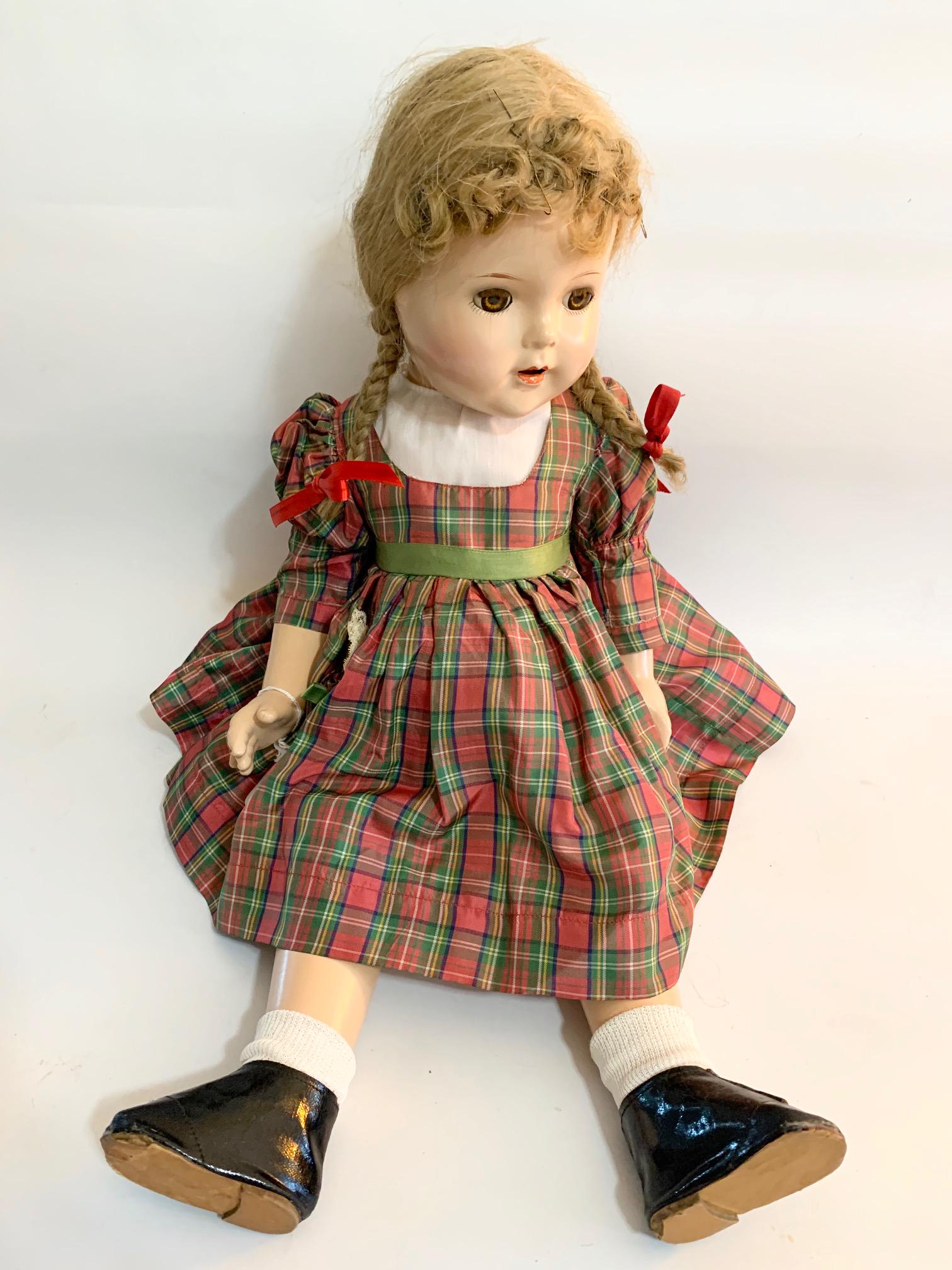 B7: Madame Alexander McGuffey Ana 23" Composition: Madame Alexander McGuffey Ana 23" composition; Appraiser identified, but head is marked Princess Elizabeth?; original tagged plaid taffeta dress; original shoes and socks; replaced underwear; original