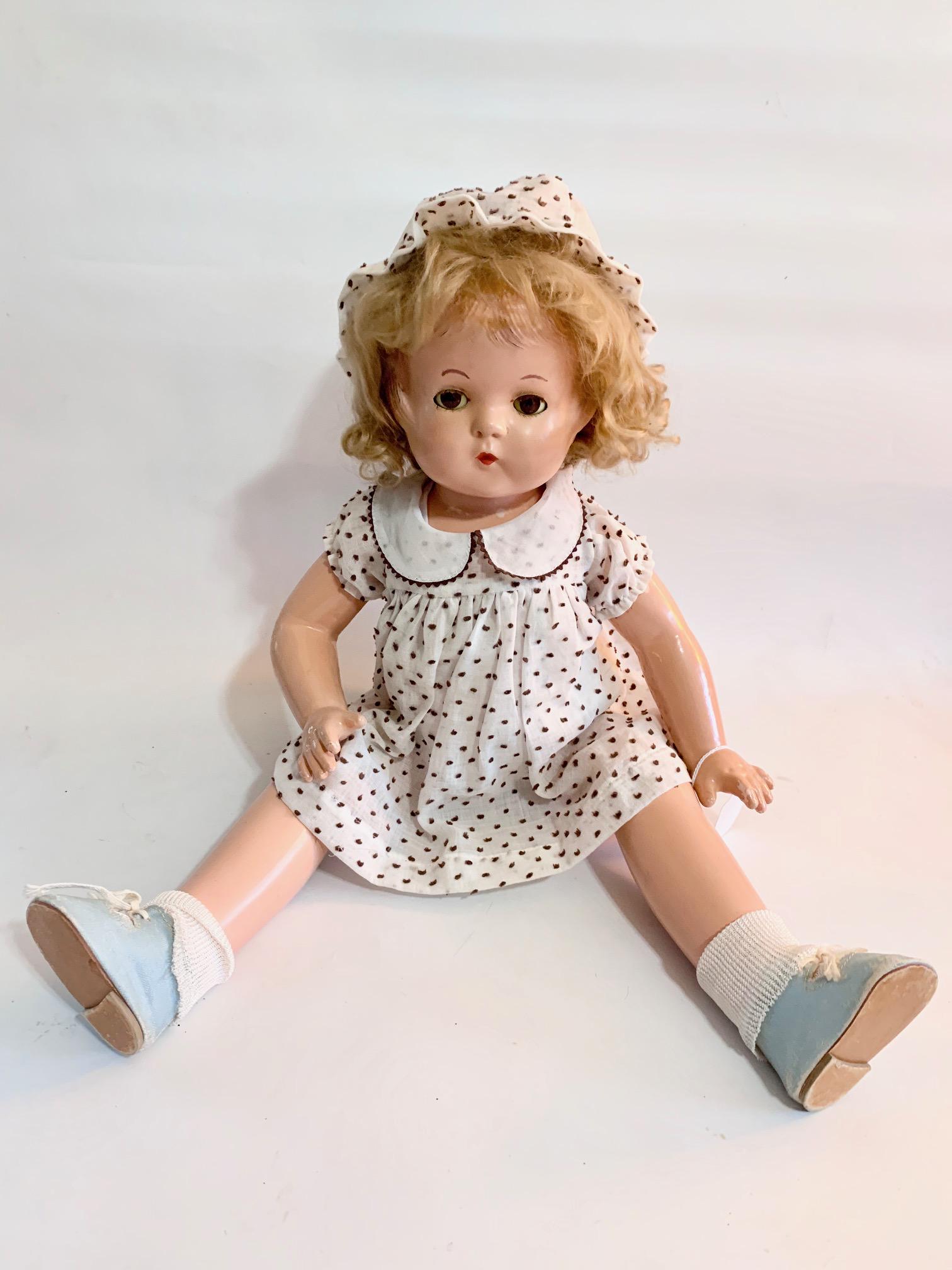 B9: Effanbee Patsy Lou 22" Composition Doll: Effanbee Patsy Lou 22" Composition Doll; well done repainting of eyes and eybrows; replaced brown and white dotted swiss dress; underwear, hat and shoes; replaced wig.