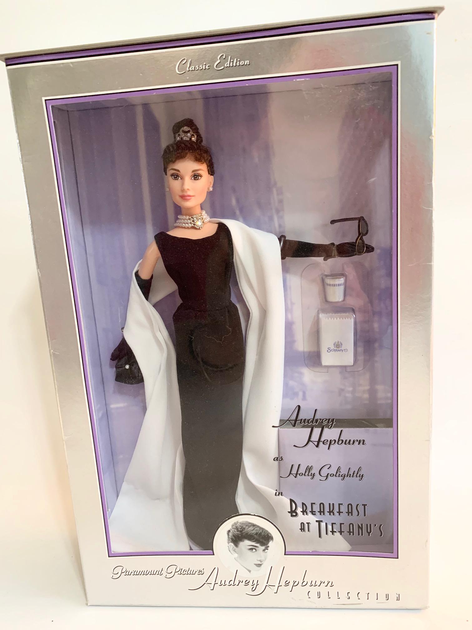 B9: Mattel Barbie 1998 Audrey Hepburn Holly Breakfast: Mattel Barbie 1998 Audrey Hepburn as Holly in Breakfast at Tiffany's New in Box; includes NIB Black Daytime Ensemble. We do our best to list all possible flaws, these are vintage/antique dolls and are