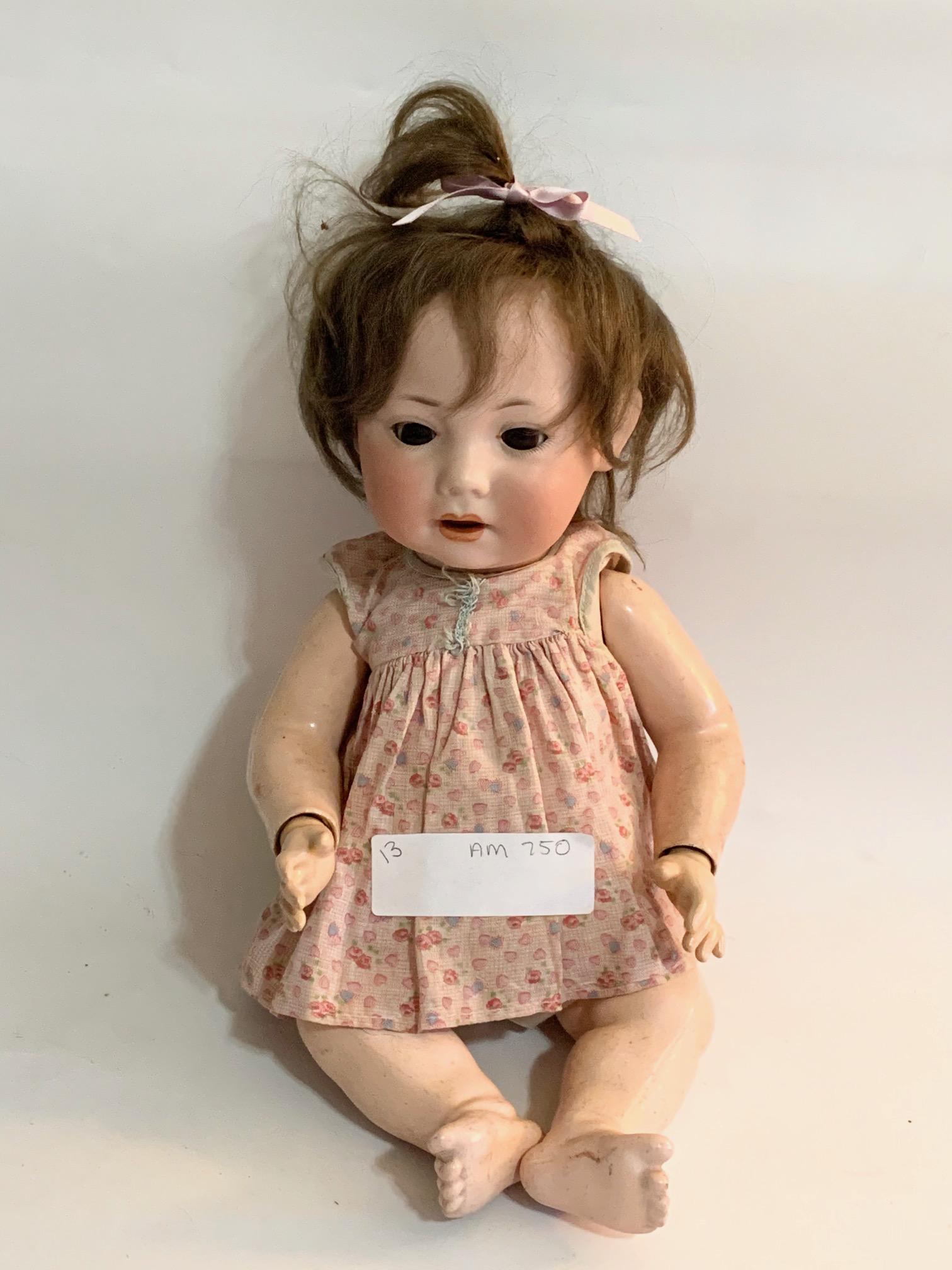 B11: Armand Marsal AM Baby 750 14" Bisque Doll: Armand Marsal AM Baby 750 14" Bisque Doll; marked on neck; brown sleep eyes; cute face. We do our best to list all possible flaws, these are vintage/antique dolls and are NOT perfect.