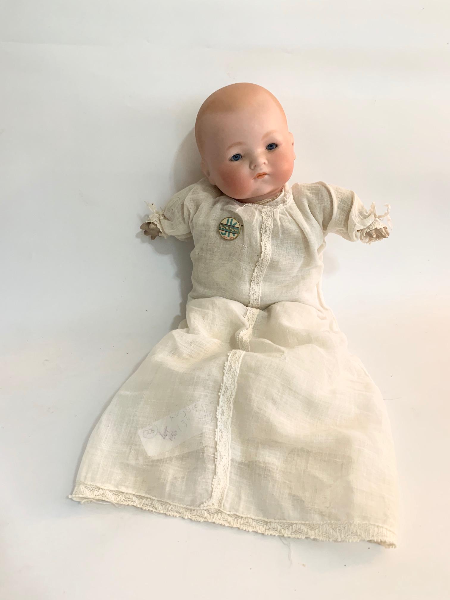 B11: Armand Marsal AM Baby Kiddie Joy 13" Bisque Doll: Armand Marsal AM Baby Kiddie Joy 13" Bisque Doll; blue sleep eyes; oriinal body, has on Byelo dress original underwear. We do our best to list all possible flaws, these are vintage/antique dolls and a