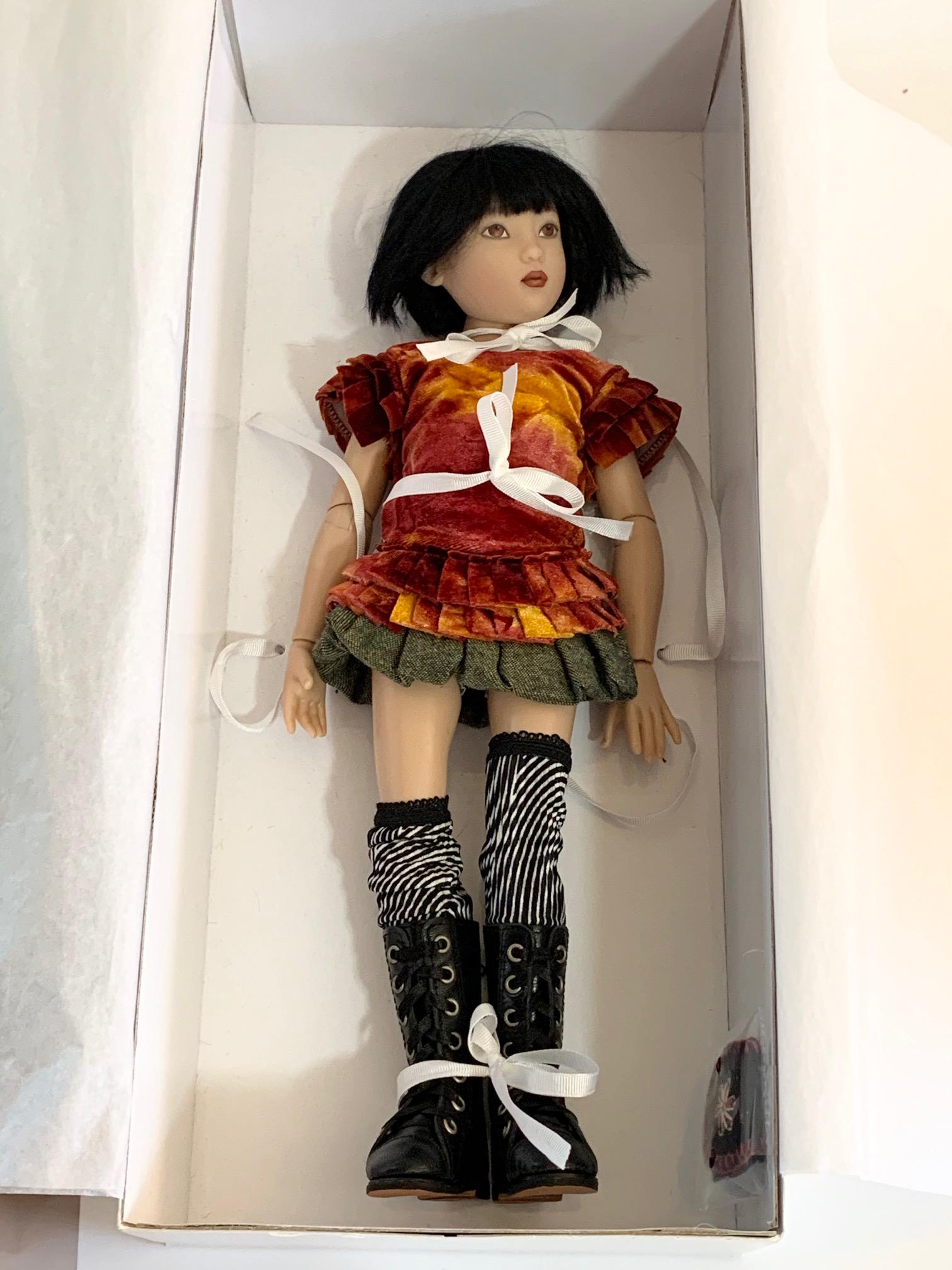 Helen Kish Urban Song 14" NIB Doll: Helen Kish Urban Song, 14 in, New, Mint, Urban Song wears a tie dyed orangey-red velvet top with unusual detailing at the sleeves and low hemline. Doesn't look like this has ever been removed from the