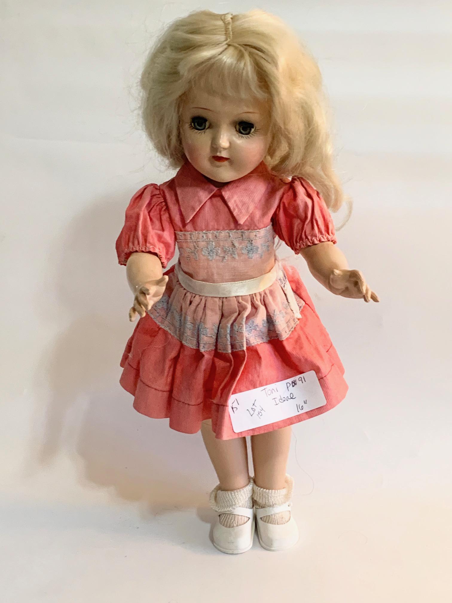 B12: Ideal Toni 16" Hard Plastic P91: Ideal Toni 16" Hard Plastic P91; original bright pink dress with blue insertion lace trim on bodice; original synthetic hair. We do our best to list all possible flaws, these are vintage/antique dolls