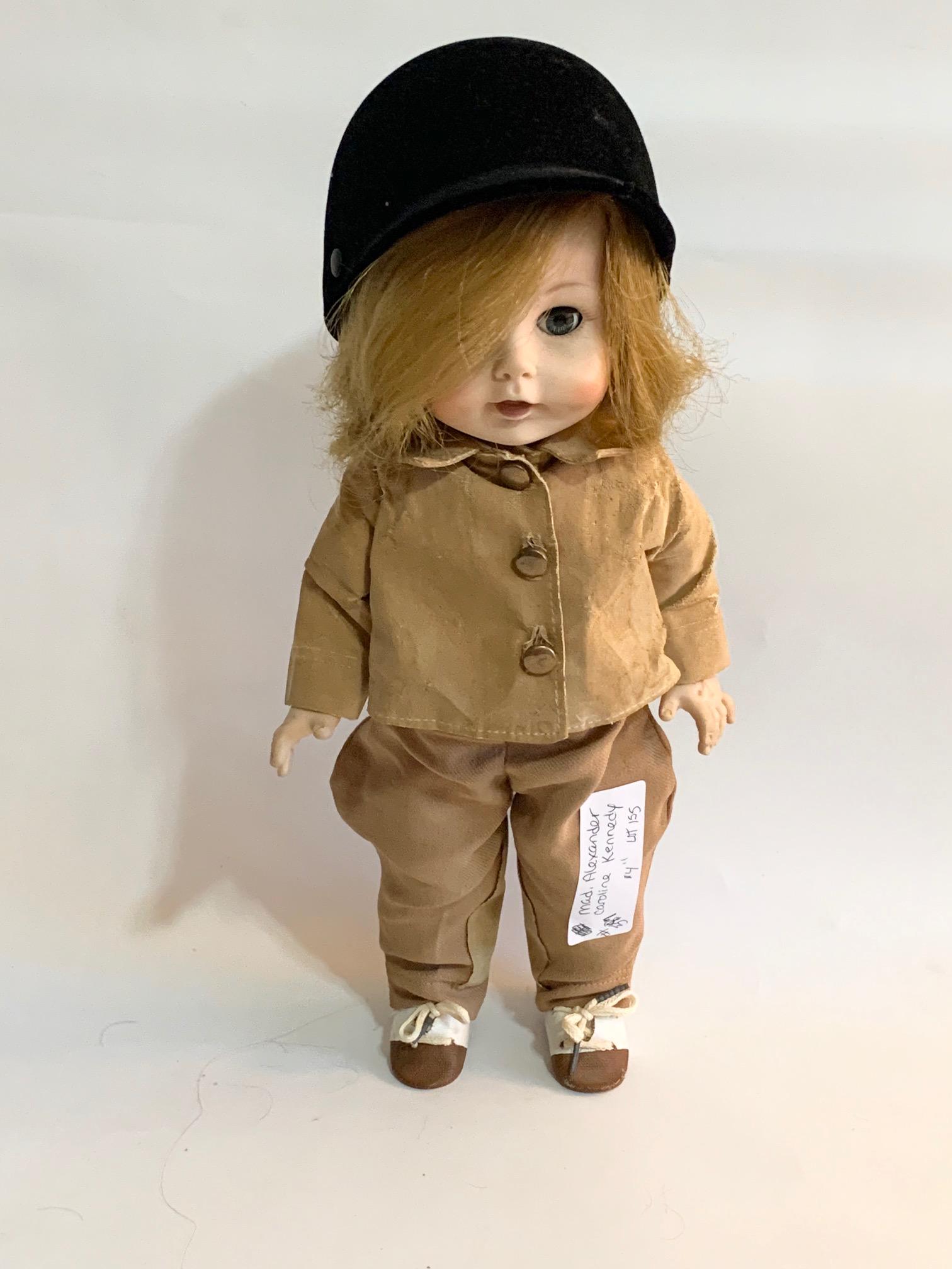 B12: Madame Alexander Caroline Kennedy 14" Vinyl Doll: Madame Alexander Caroline Kennedy 14" Vinyl; original riding acket and jodhpurs; with original hat and original wig. We do our best to list all possible flaws, these are vintage/antique dolls and are 