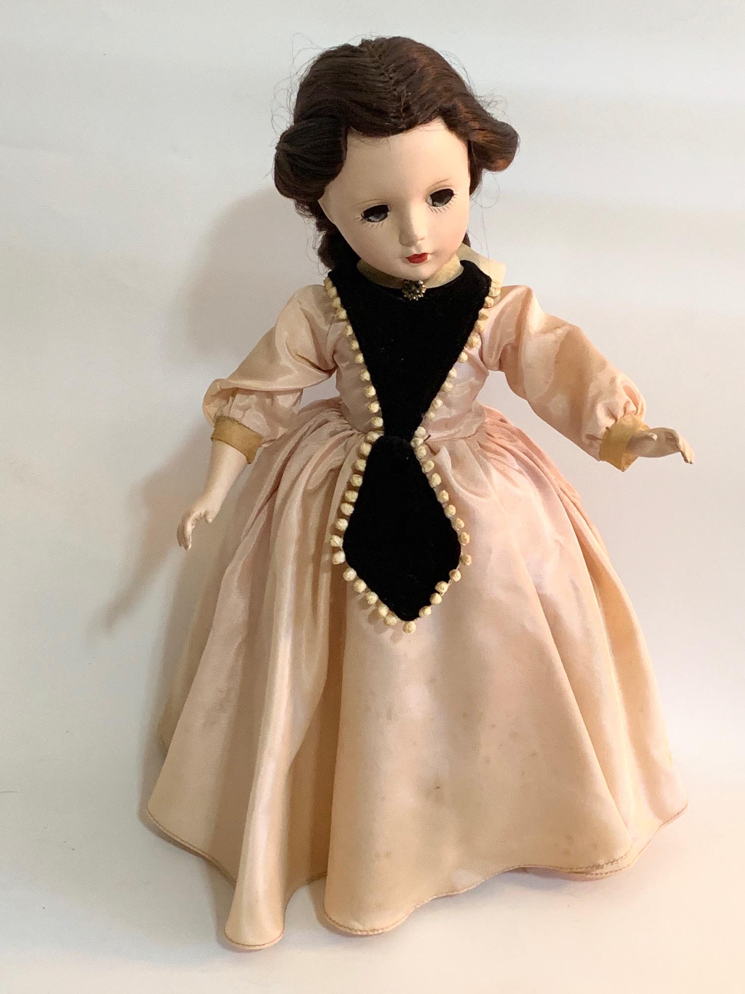 B12: Madame Alexander Marmee 14" Hard Plastic Doll: Madame Alexander Marmee 14" Hard Plastic Doll; original brown dress with black tim; shoes replaced; original wig. We do our best to list all possible flaws, these are vintage/antique dolls and are NOT