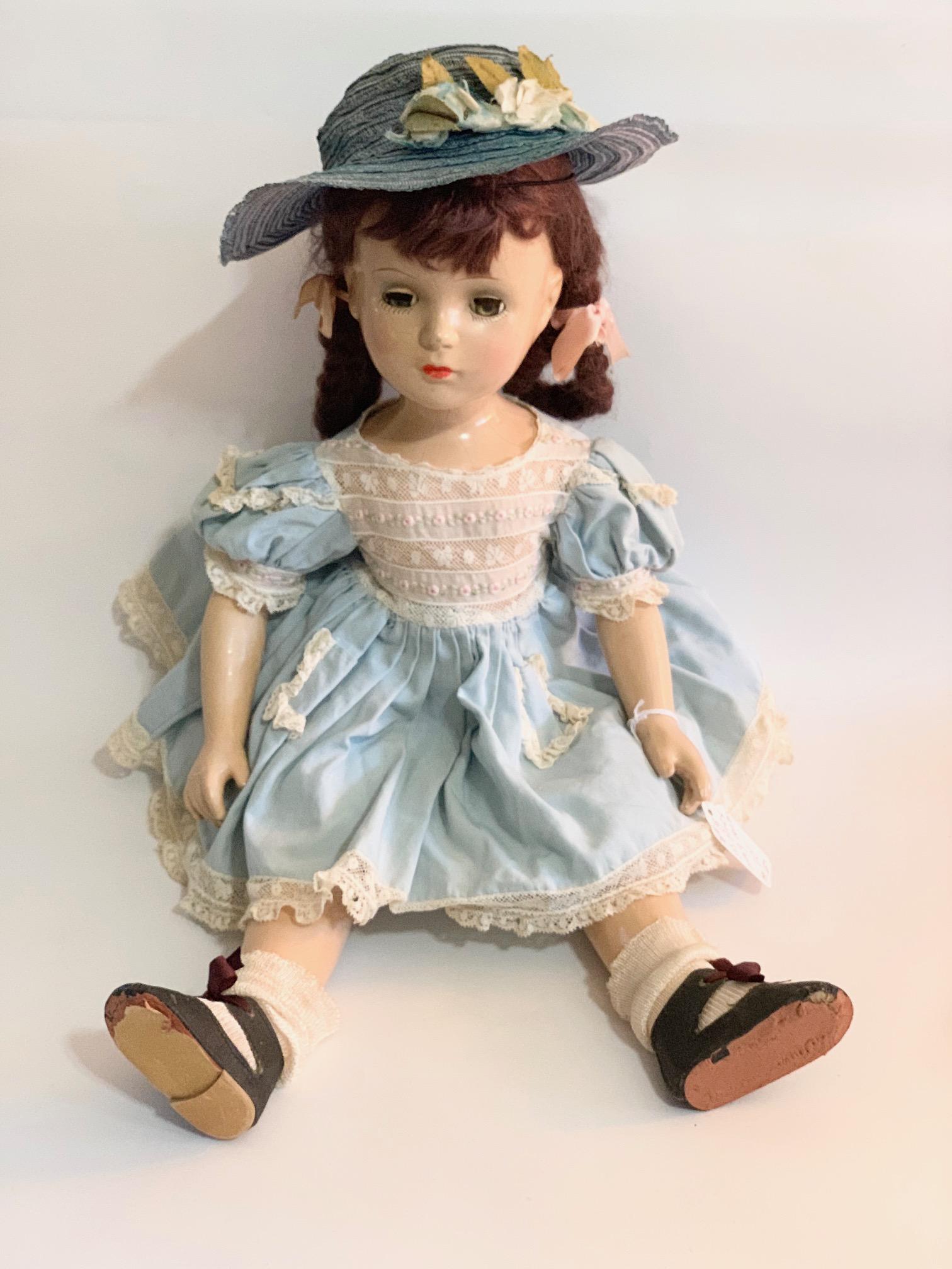B12: Madame Alexander Margaret O: Madame Alexander Margaret O'Brien 18" Hard Plastic Doll; original dress with some fading; shoes replaced; original wig. We do our best to list all possible flaws, these are vintage/antique dolls and a